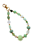 Green sun bag charm